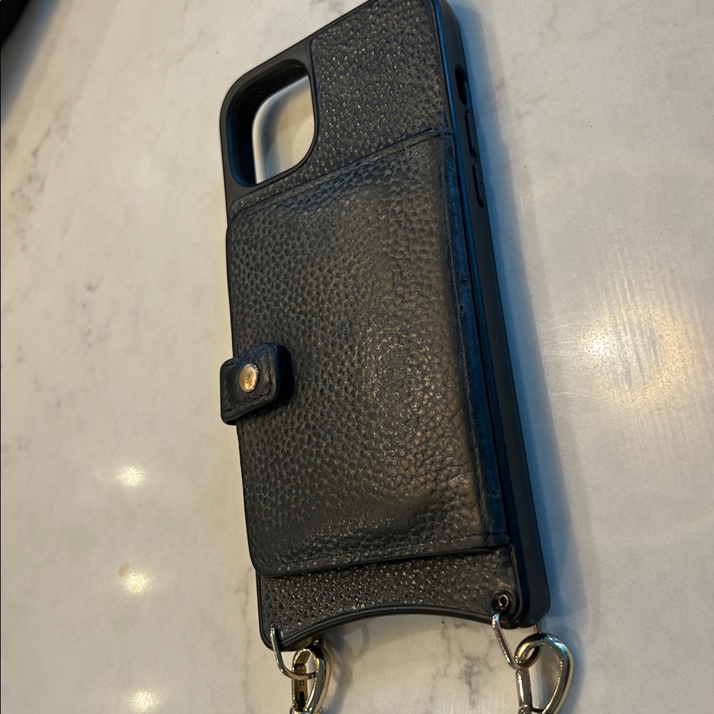 Black leather Bandolino Case Apple 14 plus along with a charger